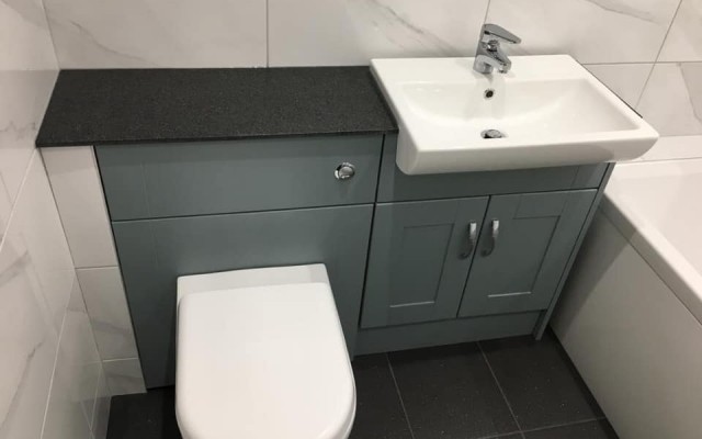 04 - K & L Heating & Bathroom Projects - Fitted Unit featuring a WC Unit and Vanity Basin